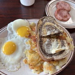 West End Diner - Two eggs sunny side up and Canadian bacon with rye toast and potatoes ... good meal to start the day