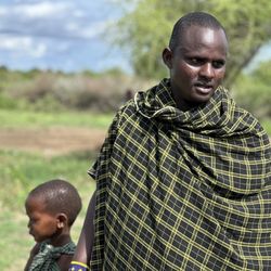 Bush Signature - Maasai man and one of his ten children