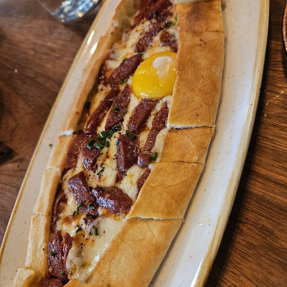 Esnaf - sucuklu pide $17...tasty slices of sausage in every bite... - Turkish Near Me - San Carlos, California