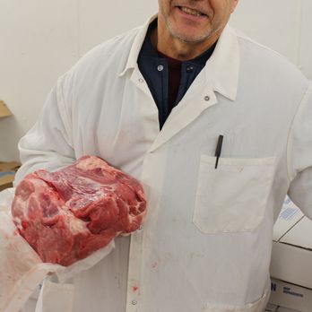 Mega Meats - a man in a lab coat holding a piece of meat - Meat Shops Near Me - Bronx, New York Mega Meats - a man in a lab coat holding a piece of meat - Meat Shops Near Me - Bronx, New York
