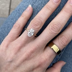 Oval solitaire natural diamond engagement ring
