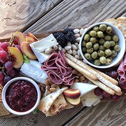 It's Chef Jess - Created with a variety of cheeses, meats, fruits and veggies with all the snacky fun stuff intermixed!