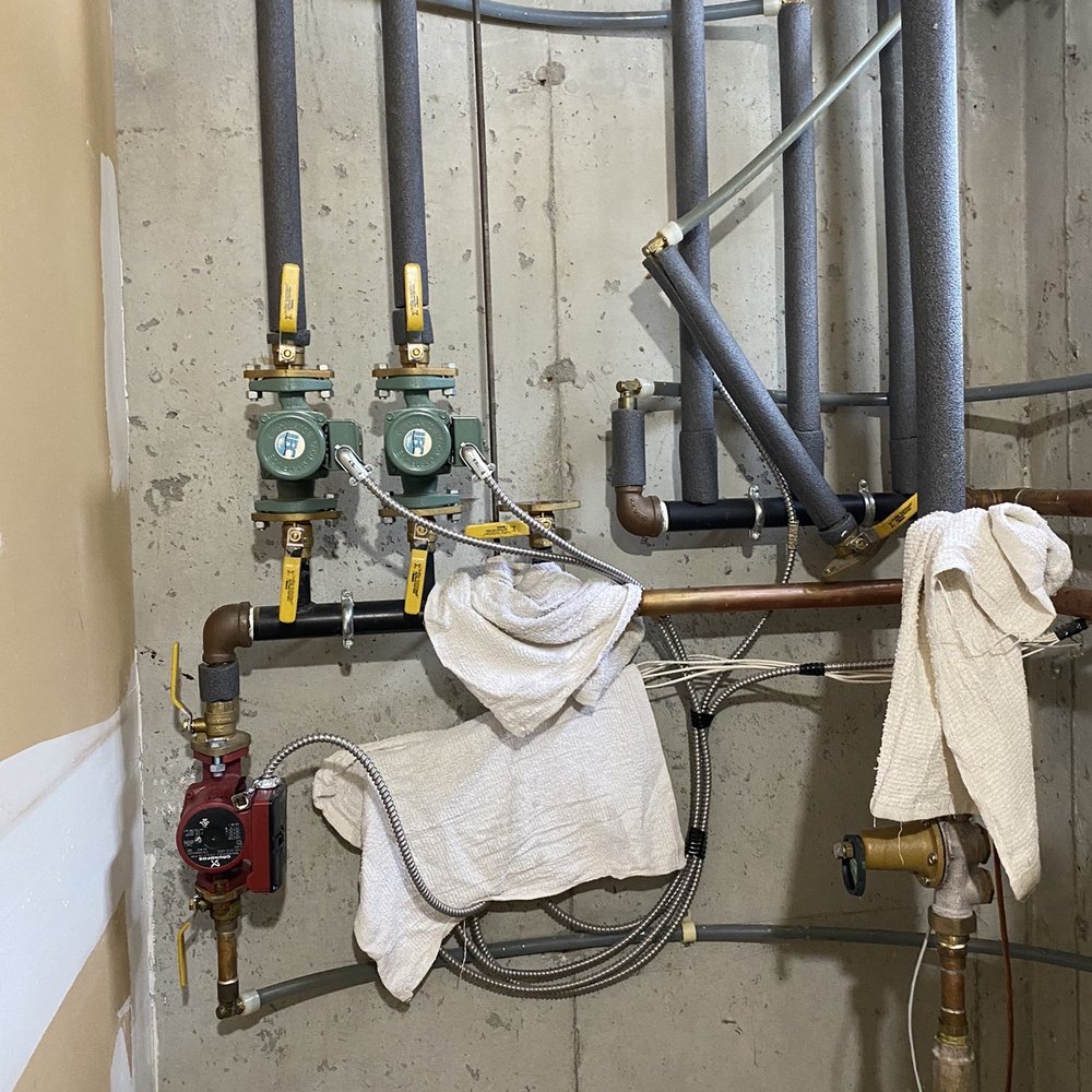 Walley's® - Technician working carefully to replace circulator pump - Heating & Air Conditioning/HVAC Near Me - Nashua, New Hampshire Walley's® - Technician working carefully to replace circulator pump - Heating & Air Conditioning/HVAC Near Me - Nashua, New Hampshire