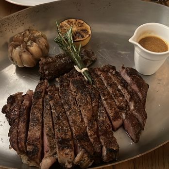 Marmo - 18 oz cowboy ribeye with porcini bone marrow jus - Italian Near Me - Houston, Texas Marmo - 18 oz cowboy ribeye with porcini bone marrow jus - Italian Near Me - Houston, Texas