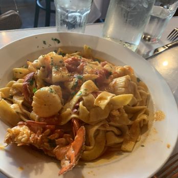 Rino's Place - Special, scallops, shrimp, lobster, spicy red sauce with fresh pappardelle pasta - Italian Near Me - Boston, Massachusetts Rino's Place - Special, scallops, shrimp, lobster, spicy red sauce with fresh pappardelle pasta - Italian Near Me - Boston, Massachusetts