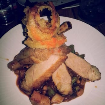 Traif - Pork with sausage, lentils, and fried onion rings on top. - New American Near Me - Brooklyn, New York Traif - Pork with sausage, lentils, and fried onion rings on top. - New American Near Me - Brooklyn, New York