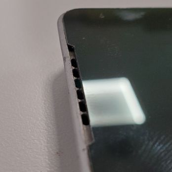 SquareTrade - Left hand side of the tablet / missing speaker grille. - Mobile Phone Repair Near Me - Brisbane, California SquareTrade - Left hand side of the tablet / missing speaker grille. - Mobile Phone Repair Near Me - Brisbane, California
