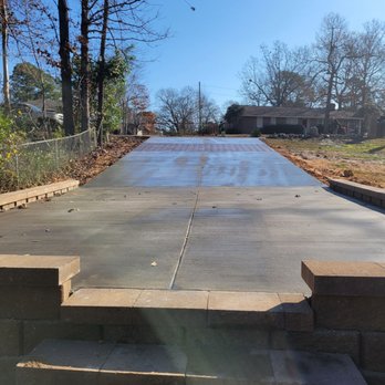 Sam The Concrete Man Augusta - Finished product with proper drainage and retaining wall to help level out the driveway. - Masonry/Concrete Near Me - Augusta, Georgia Sam The Concrete Man Augusta - Finished product with proper drainage and retaining wall to help level out the driveway. - Masonry/Concrete Near Me - Augusta, Georgia