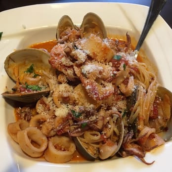 Cafe Fiore - ZUPPAD'PESCE It came with assorted seafood, shrimp, scallops, calamari and clams in a red sauce, served over linguine . - Italian Near Me - Branford, Connecticut Cafe Fiore - ZUPPAD'PESCE It came with assorted seafood, shrimp, scallops, calamari and clams in a red sauce, served over linguine . - Italian Near Me - Branford, Connecticut