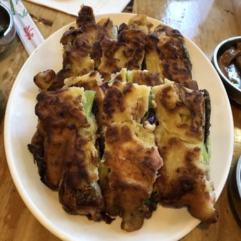 Moa Korean BBQ - Seafood pancake - huge portion! But giant pieces of green onion inside were awkward to eat. - Korean Near Me - Pleasant Hill, California Moa Korean BBQ - Seafood pancake - huge portion! But giant pieces of green onion inside were awkward to eat. - Korean Near Me - Pleasant Hill, California