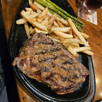 Outback Steakhouse - NY Steak 15oz with aussie fries and asparagus - Steakhouses Near Me - Northridge, California