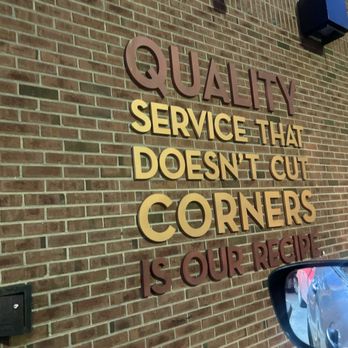 Wendy's - a sign on a brick wall that says quality service that doesn't cut corners is good price - Fast Food Near Me - Chicago, Illinois Wendy's - a sign on a brick wall that says quality service that doesn't cut corners is good price - Fast Food Near Me - Chicago, Illinois
