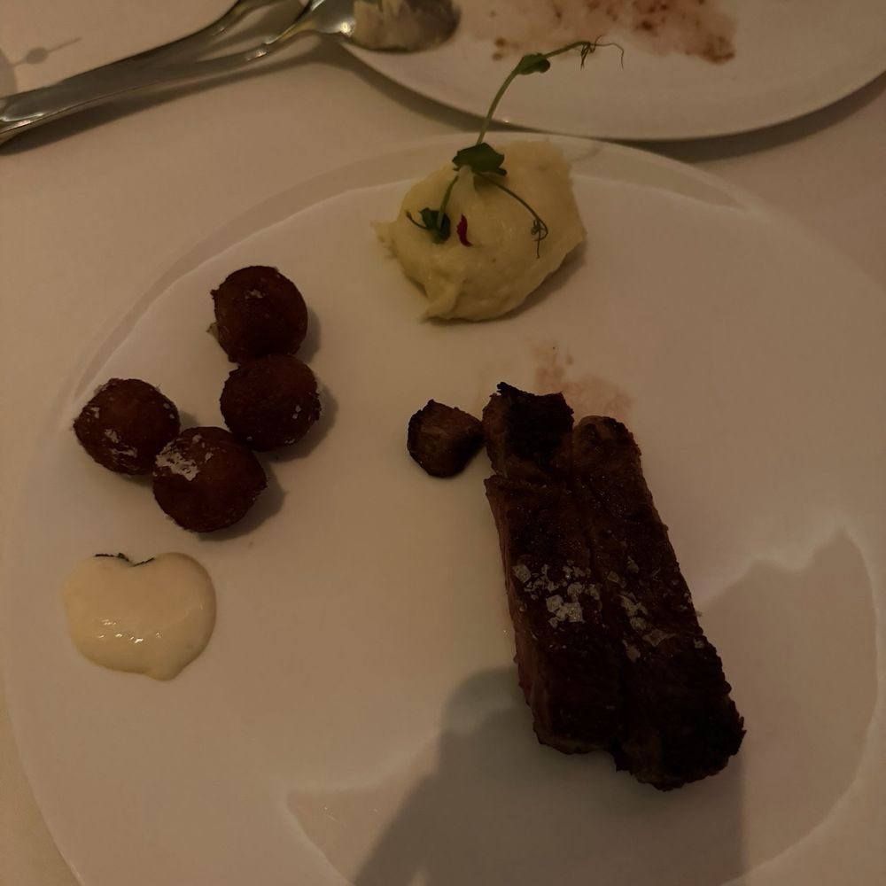 Australian Wagyu Boneless Ribeye cooked medium, with crispy potato mochi and yuzu sauce
