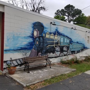 Cucinella's Brick Oven Pizzeria - a train painted on the side of a building - Pizza Near Me - Madison, Florida Cucinella's Brick Oven Pizzeria - a train painted on the side of a building - Pizza Near Me - Madison, Florida