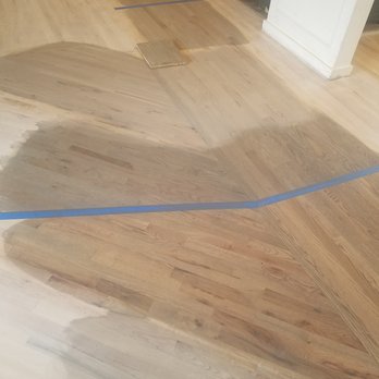 Accent Custom Flooring - a hardwood floor being painted - Flooring Near Me