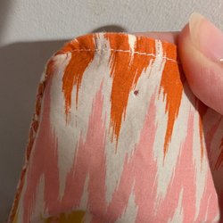 Global Thrift Store - Pinholes in clothing from store tags