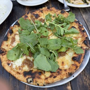 Gjelina - Gruyere, Caramelized Onion, Fromage Blanc & Arugula pizza - New American Near Me - Venice, California Gjelina - Gruyere, Caramelized Onion, Fromage Blanc & Arugula pizza - New American Near Me - Venice, California