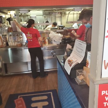IHOP - a woman in a red shirt working in a restaurant - Breakfast & Brunch Near Me - Edison, New Jersey