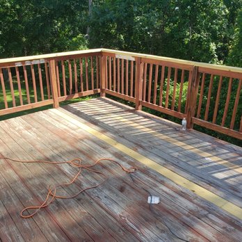 Quality Solutions - a deck with a wood decking system - Flooring Near Me Quality Solutions - a deck with a wood decking system - Flooring Near Me