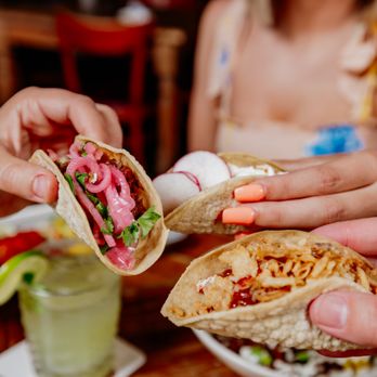truk't - a person holding a sandwich in their hand - Tacos Near Me - Beloit, Wisconsin truk't - a person holding a sandwich in their hand - Tacos Near Me - Beloit, Wisconsin