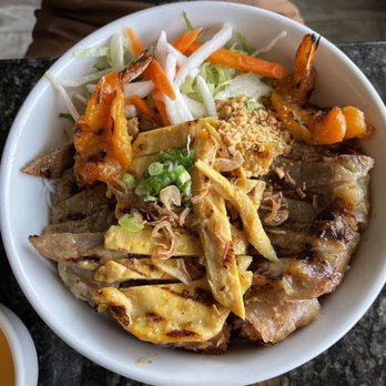 Pho Real Saigon - a bowl of food on a table - Vietnamese Near Me - Denver, Colorado