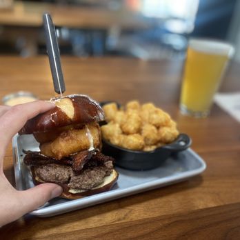 Tapped Public House - Pretzel Burger with Tater Tots - American Near Me - Mukilteo, Washington Tapped Public House - Pretzel Burger with Tater Tots - American Near Me - Mukilteo, Washington