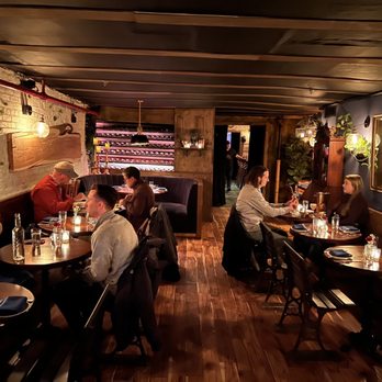 Alice Restaurant - people sitting at tables in a restaurant - Italian Near Me - New York, New York