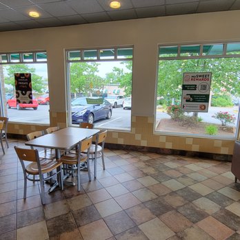 Krispy Kreme - Seating area on side of the store where we entered. Notice the guy sleeping. - Donuts Near Me - Alexandria, Virginia Krispy Kreme - Seating area on side of the store where we entered. Notice the guy sleeping. - Donuts Near Me - Alexandria, Virginia