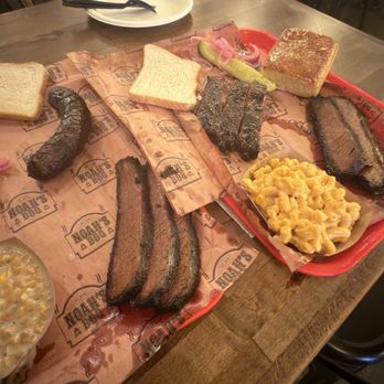 Noah's BBQ - Two trays of dirt dry brisket. The ribs were mid at best. Corn bread was the best side and it was extra - Barbeque Near Me - Braintree, Massachusetts