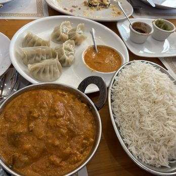 Curry & Kabob - Clockwise: Chicken Momo gobbled quickly, basmati rice, Lamb Korma. - Indian Near Me - Columbia, Maryland Curry & Kabob - Clockwise: Chicken Momo gobbled quickly, basmati rice, Lamb Korma. - Indian Near Me - Columbia, Maryland