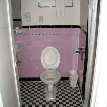 The Embassy Hotel - the flusher is behind the toilet seat - you have to stand up and use your foot - Hotels Near Me - San Francisco, California The Embassy Hotel - the flusher is behind the toilet seat - you have to stand up and use your foot - Hotels Near Me - San Francisco, California