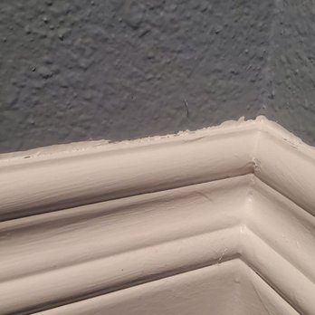 JG Decor - Sloppy painting around baseboard. Andrew and his painters all played dumb, pretending like they didn't understand what was wrong. - General Contractors Near Me - Placentia, California
