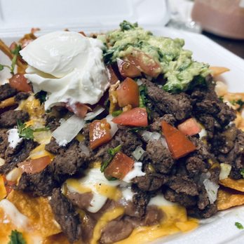 Tacos El Patron - Nachos with asada guac and sour cream - Tacos Near Me - Seatac, Washington Tacos El Patron - Nachos with asada guac and sour cream - Tacos Near Me - Seatac, Washington