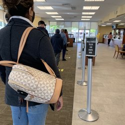 Wells Fargo Bank - The one teller open. 42 min wait. 6 other employees wandering around drinking from sippy cups