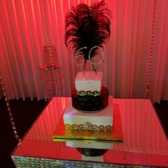 Cake Boutique Bakery - a three tiered cake on a glass table - Patisserie/Cake Shop Near Me - Miami, Florida