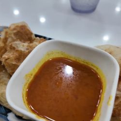 Singapore Hawker - Roti Chennai with curry sauce. They do a really great version here.