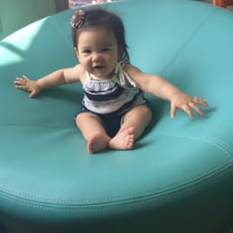 Madi loves to sit in the Tiffany Blue seats in the A to Z lobby :-)