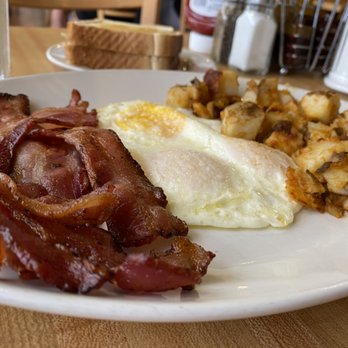 Sunset Grill - a plate of bacon, eggs, and hash browns - Diners Near Me - Toronto, Ontario