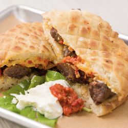 Cafe Balkan - Ground beef skinless sausage served on homemade pita bread