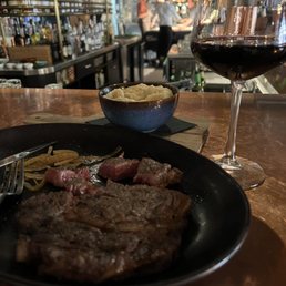 Rib Eye, garlic mashed potatoes and a Cab Sauv. Very limited wine list TBH. Rib Eye, garlic mashed potatoes and a Cab Sauv. Very limited wine list TBH.