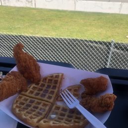 a plate of fried chicken and waffles a plate of fried chicken and waffles