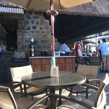 Off the Hook - Basic sized tables. Seats 4-6 comfortably.  With the bar in the background - Lounges Near Me - Kapolei, Hawaii