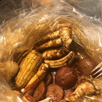 Crafty Crab - Crab, corn, potatoes, saugage, and boiled eggs with all three seasons combined called the boom I believe. Medium spicy. - Seafood Near Me - Lauderhill, Florida
