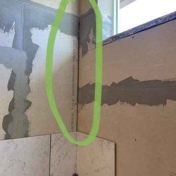 Integrity Tile & Stone - Worker was tiling over this w/o tape or mud on backerboard. - General Contractors Near Me - Colorado Springs, Colorado Integrity Tile & Stone - Worker was tiling over this w/o tape or mud on backerboard. - General Contractors Near Me - Colorado Springs, Colorado
