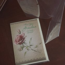 Dollar Zone - Check out the plastic sleeves around the greeting cards. Stays clean and doesn't get separated from it's envelope. Genius.