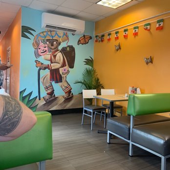 Tacos Monarca - a man with a tattoo on his arm - Mexican Near Me - Gettysburg, Pennsylvania