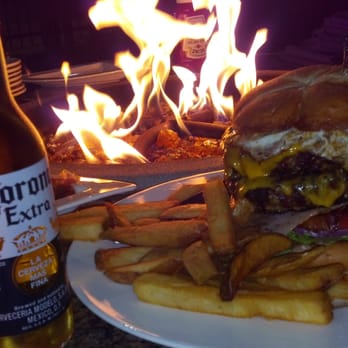 The Delta Bistro & Lounge - Chill sunday night with family next to the fire on the delta eating this crazy tall monster burger so good! - Lounges Near Me - Stockton, California