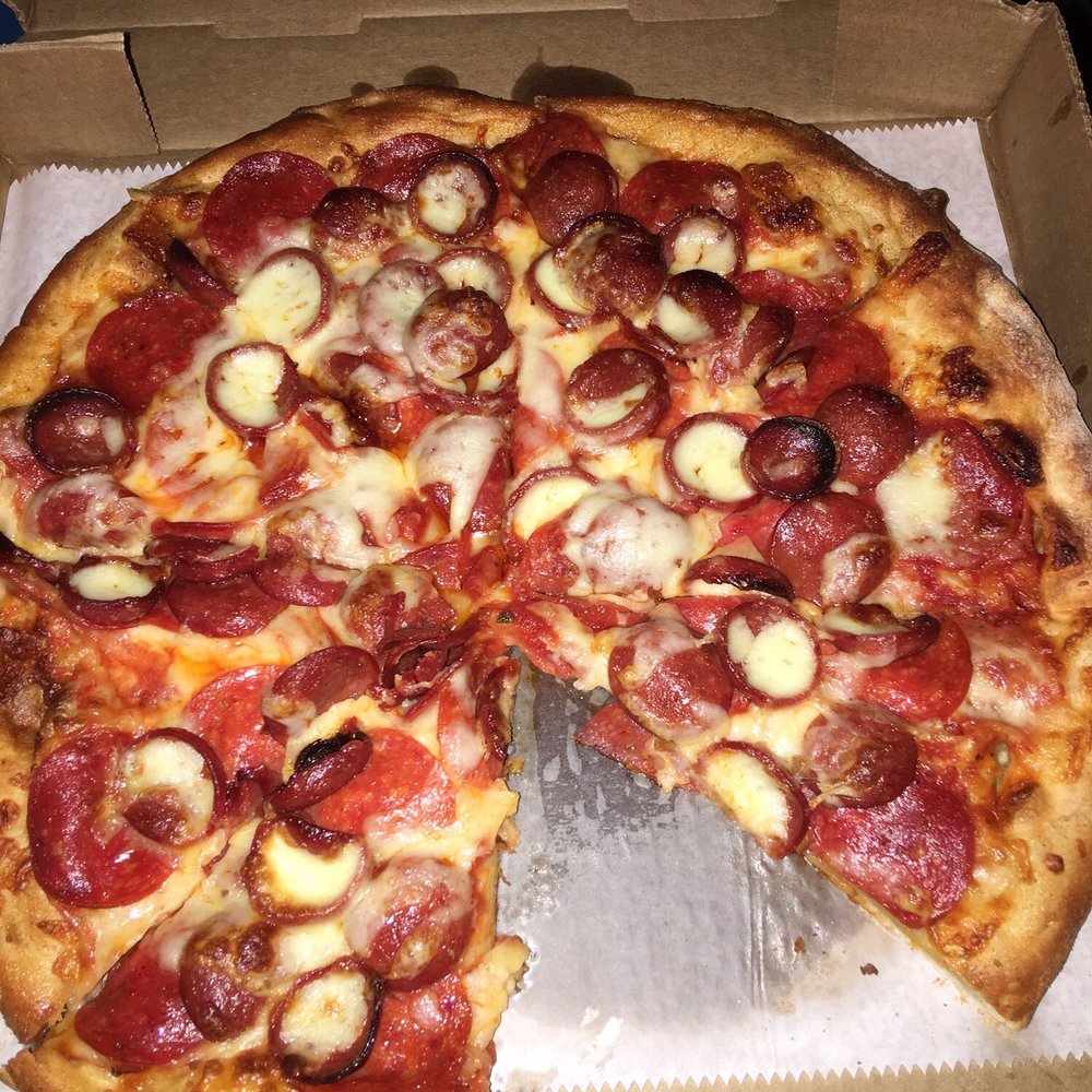 This is a small pepperoni lovers pizza. It has regular pepperoni and char pepperoni. The pizza was loaded with toppings.