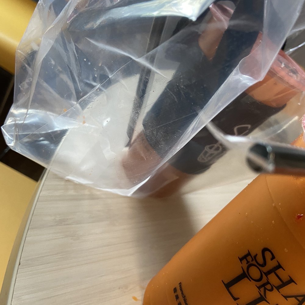 Teatopia - Thai Tea (tea is inside the bag and around both cups - drinks weren't wiped off) - Bubble Tea Near Me - Long Beach, California