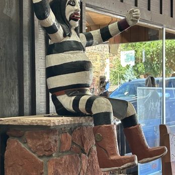 Outlaw Grille - Sad statue appears in "Black Face," only one without watermelon. Interesting! - Salad Near Me - Sedona, Arizona Outlaw Grille - Sad statue appears in "Black Face," only one without watermelon. Interesting! - Salad Near Me - Sedona, Arizona